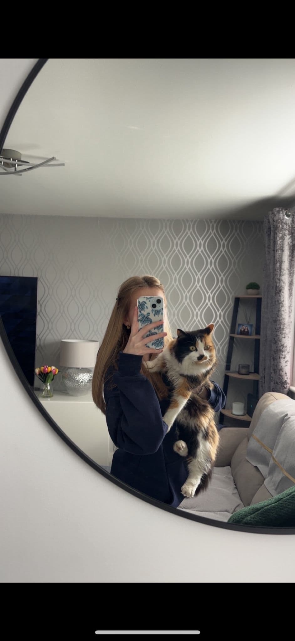 Belle holding a cat